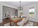 Cozy dining area featuring stylish chandelier, table setting, and neutral decor at 332 Canvasback Rd, Mooresville, NC 28117