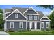 Two-story craftsman style home with gray siding and white trim at 332 Canvasback Rd, Mooresville, NC 28117