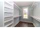 Spacious walk-in closet with custom shelving, providing ample storage and organization with a view from the window at 332 Canvasback Rd, Mooresville, NC 28117