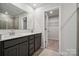 Bathroom with double vanity, walk-in shower, and closet at 335 Bezelle Ave, York, SC 29745