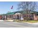 Modern fire station with a green roof and American flag at 335 Bezelle Ave, York, SC 29745