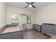 Well-lit bedroom with two windows, a crib, and a changing table, perfect for a Bedroom at 4085 Brandy Creek Ct, Clover, SC 29710