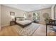 Spacious main bedroom with tray ceilings, large windows, and neutral decor at 225 English Arbor Dr # 13, Fort Mill, SC 29715