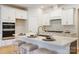 Modern kitchen featuring white cabinets, stainless steel appliances and a large island with seating at 225 English Arbor Dr # 13, Fort Mill, SC 29715