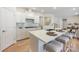 This modern kitchen features stainless steel appliances and a large island with seating at 225 English Arbor Dr # 13, Fort Mill, SC 29715