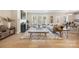 Open-concept living room with hardwood floors, a fireplace, and large windows offering backyard views at 225 English Arbor Dr # 13, Fort Mill, SC 29715