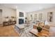 Comfortable living room featuring a fireplace, large windows, and stylish, neutral-toned decor at 225 English Arbor Dr # 13, Fort Mill, SC 29715