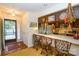 Kitchen with breakfast bar, ample counter space, and view to front entry at 102 Cedar Hollow St, Fort Mill, SC 29715