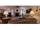Cozy living room featuring a stone fireplace, ceiling fan, and comfortable furniture at 102 Cedar Hollow St, Fort Mill, SC 29715