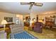 Spacious living area with open layout to the dining area, breakfast bar, and front entry at 102 Cedar Hollow St, Fort Mill, SC 29715