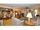 Open-concept living space with a view of the kitchen, dining area, and fireplace at 102 Cedar Hollow St, Fort Mill, SC 29715