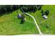 Aerial view showing a workshop, driveway, and surrounding pasture land at 120 Zorse Ln, Statesville, NC 28625