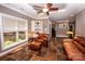 Comfortable living room featuring leather furniture and tile floors at 120 Zorse Ln, Statesville, NC 28625