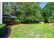 Spacious backyard with a screened porch and storage shed at 2594 Knoll Ridge Ct, Hickory, NC 28602