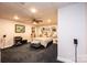 Finished basement with a bedroom, built-in shelving, and ceiling fan at 2594 Knoll Ridge Ct, Hickory, NC 28602