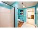 Basement bathroom with walk-in shower and teal walls at 2594 Knoll Ridge Ct, Hickory, NC 28602
