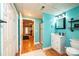 Basement bathroom with white vanity and teal accents at 2594 Knoll Ridge Ct, Hickory, NC 28602