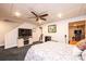 Spacious finished basement bedroom with TV and ceiling fan at 2594 Knoll Ridge Ct, Hickory, NC 28602