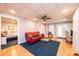 Finished basement with red couch and access to patio at 2594 Knoll Ridge Ct, Hickory, NC 28602