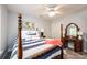 Cozy bedroom with a four-poster bed and a built-in vanity at 2594 Knoll Ridge Ct, Hickory, NC 28602