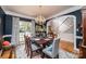 Formal dining room features hardwood floors, a chandelier and view to the entry at 2594 Knoll Ridge Ct, Hickory, NC 28602