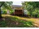 Two-story house with a large deck and screened porch, nestled in a wooded setting at 2594 Knoll Ridge Ct, Hickory, NC 28602