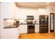 Modern kitchen with white cabinets and granite countertops at 2594 Knoll Ridge Ct, Hickory, NC 28602