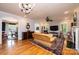Spacious living room featuring hardwood floors, a fireplace, and ample natural light at 2594 Knoll Ridge Ct, Hickory, NC 28602
