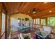 Spacious screened porch with dining area and comfortable seating, offering a tranquil outdoor space at 2594 Knoll Ridge Ct, Hickory, NC 28602