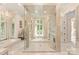 Spa-like bathroom features a mosaic glass shower, soaking tub, and luxury fixtures at 423 Oakmont Ln, Waxhaw, NC 28173