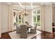 Charming dining room with hardwood floors, elegant lighting, and a view of the outdoor pool at 423 Oakmont Ln, Waxhaw, NC 28173