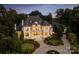 Stunning exterior view of a luxury home with manicured landscaping and a circular driveway at 423 Oakmont Ln, Waxhaw, NC 28173