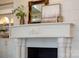 Close-up of fireplace mantel with elegant decor, showcasing the room's detailed trim work at 423 Oakmont Ln, Waxhaw, NC 28173