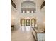 Grand foyer with marble floors, soaring ceilings, an ornate balcony, chandelier, and views to the exterior at 423 Oakmont Ln, Waxhaw, NC 28173