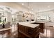 Spacious kitchen featuring coffered ceilings, large marble countertops, and hardwood floors at 423 Oakmont Ln, Waxhaw, NC 28173
