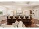 Open kitchen design featuring a large center island with counter seating and custom cabinetry at 423 Oakmont Ln, Waxhaw, NC 28173