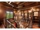 Library boasting custom wood paneling, bookshelves, and a grand chandelier at 423 Oakmont Ln, Waxhaw, NC 28173