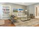 Comfortable basement sitting area with a sofa and armchairs at 1218 Wareham Ct, Charlotte, NC 28207