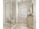 Spa-like bathroom with a walk-in shower and modern vanity at 1218 Wareham Ct, Charlotte, NC 28207