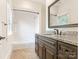 Updated bathroom with granite countertop, dark brown cabinets, and a shower/tub combo at 1218 Wareham Ct, Charlotte, NC 28207