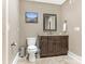 Well-appointed bathroom with dark brown vanity and granite countertop at 1218 Wareham Ct, Charlotte, NC 28207