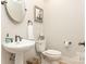 Modern powder room with pedestal sink and updated fixtures at 1218 Wareham Ct, Charlotte, NC 28207