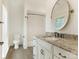 Modern bathroom with granite countertop, white cabinets, and a bathtub at 1218 Wareham Ct, Charlotte, NC 28207