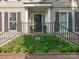 Elegant front entrance with black door and iron railings at 1218 Wareham Ct, Charlotte, NC 28207