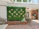 Landscaped garden with lush greenery and brick wall at 1218 Wareham Ct, Charlotte, NC 28207
