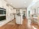 Open kitchen with island and skylights at 1218 Wareham Ct, Charlotte, NC 28207