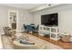 Bright living room features a large TV, comfortable seating, and a dining area at 1218 Wareham Ct, Charlotte, NC 28207