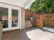 Outdoor kitchen area with built-in grill and brick accents at 1218 Wareham Ct, Charlotte, NC 28207