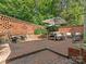 Brick patio with seating area, offering a private outdoor space at 1218 Wareham Ct, Charlotte, NC 28207