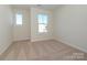 Bright bedroom with neutral walls, carpet, and window at 10509 Boudreaux St, Huntersville, NC 28078